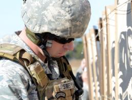 Staff Sgt. Mindy Bloem Second Lt. Brian Street, 147th Civil Engineer Squadron assigned to Ellington Field Joint Reserve Base in Houston, checks his target at the Governor's 20 Pistol Match Jan. 24, 2015, at Camp Swift, Texas